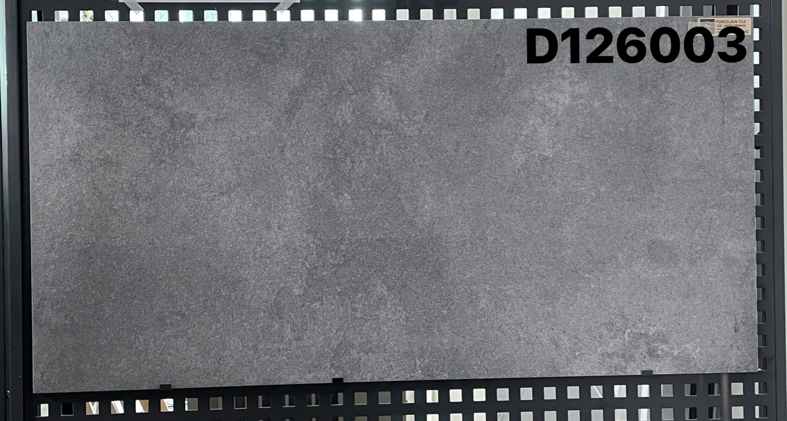 Gray tile sample labeled D126003 on display.