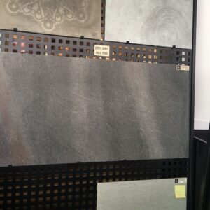 Display of various tiles with a 20% off sign.