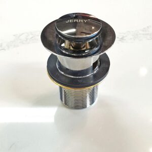 Chrome sink drain plug on white surface.