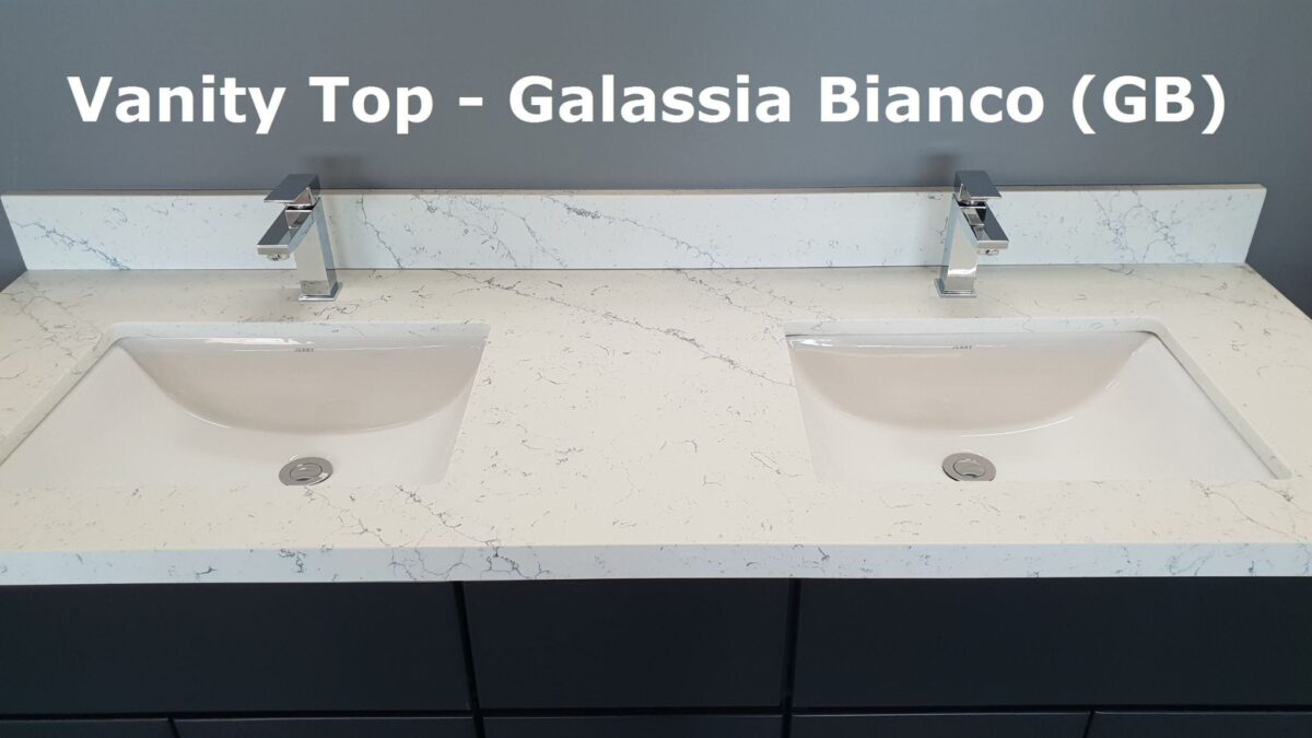 Double sink with Galassia Bianco countertop in modern kitchen.