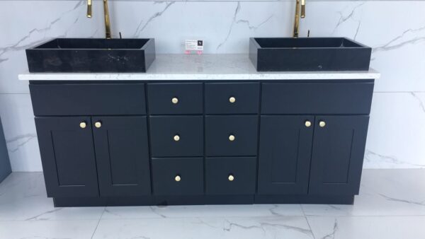1800.jpg Black double sink vanity with marble countertop and gold fixtures.