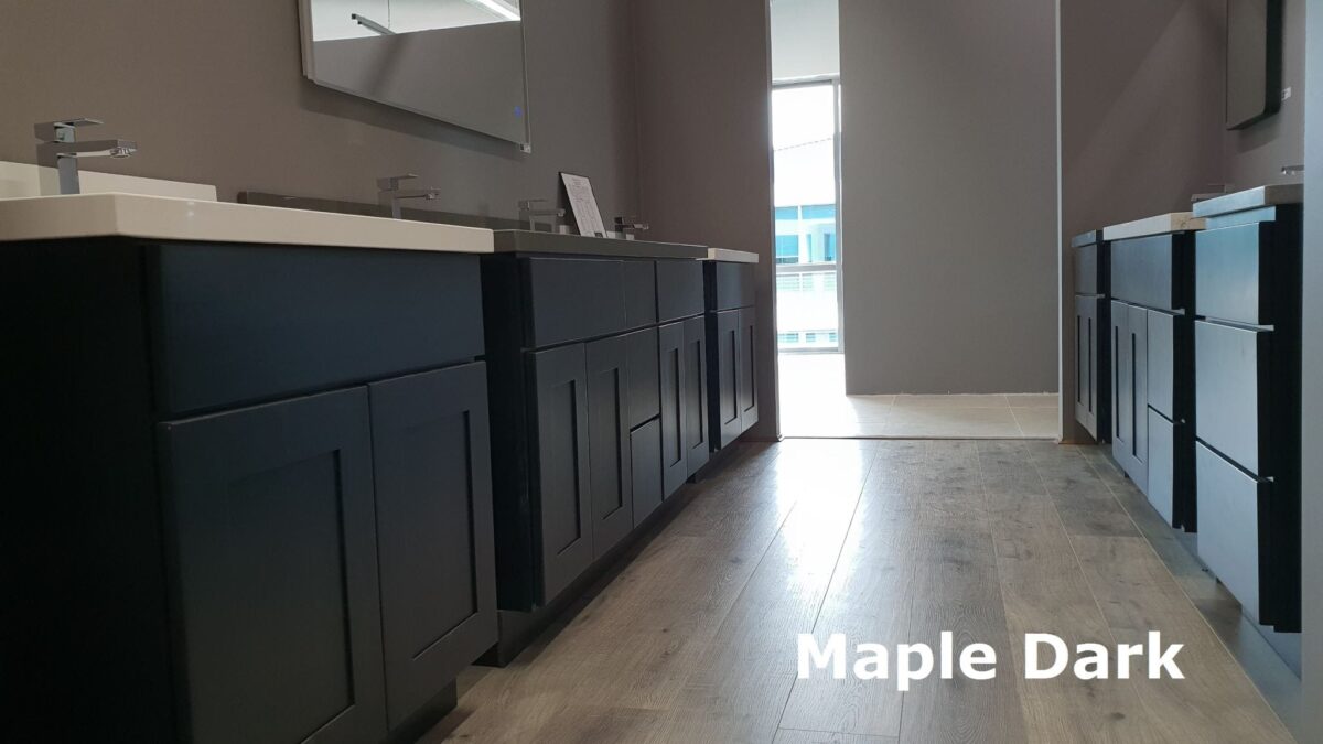 Dark maple kitchen cabinets with modern sinks and mirrors.