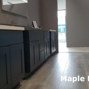 Dark maple kitchen cabinets with modern sinks and mirrors.