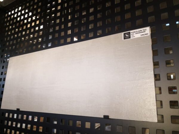 Porcelain tile display on black grid wall at Jerry Kitchen.
