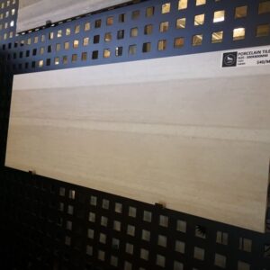 Porcelain tile display in showroom with price tag.