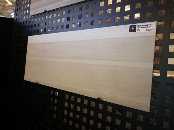 Porcelain tile display in showroom with price tag.