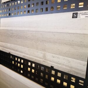 Porcelain tile display with price tag in a showroom.