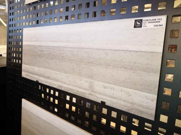 Porcelain tile display with price tag in a showroom.