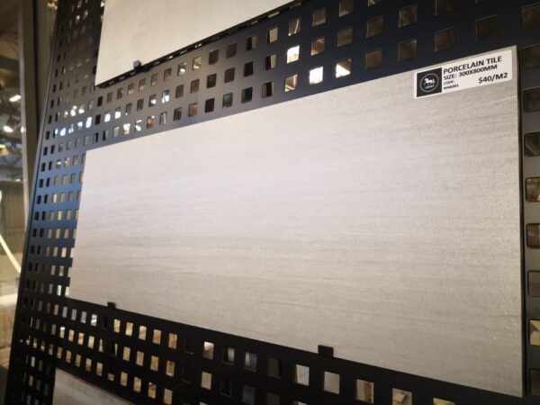833276524.jpg Porcelain tile display with price tag in a showroom.