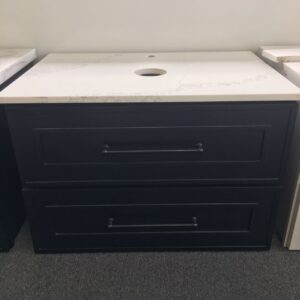 Black bathroom vanity with white countertop and two drawers.
