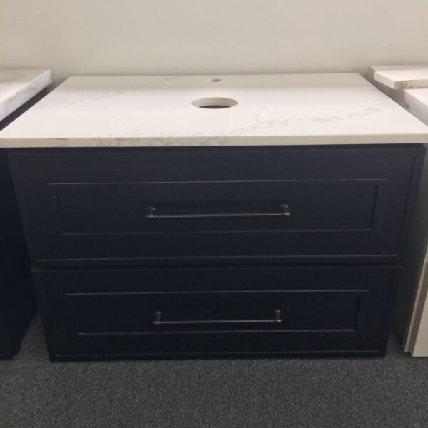 Black bathroom vanity with white countertop and two drawers.