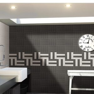 Modern bathroom with geometric black and white tile design.