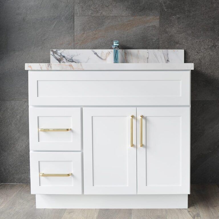 White bathroom vanity with marble countertop and gold handles.