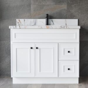 White bathroom vanity with marble countertop and black faucet.