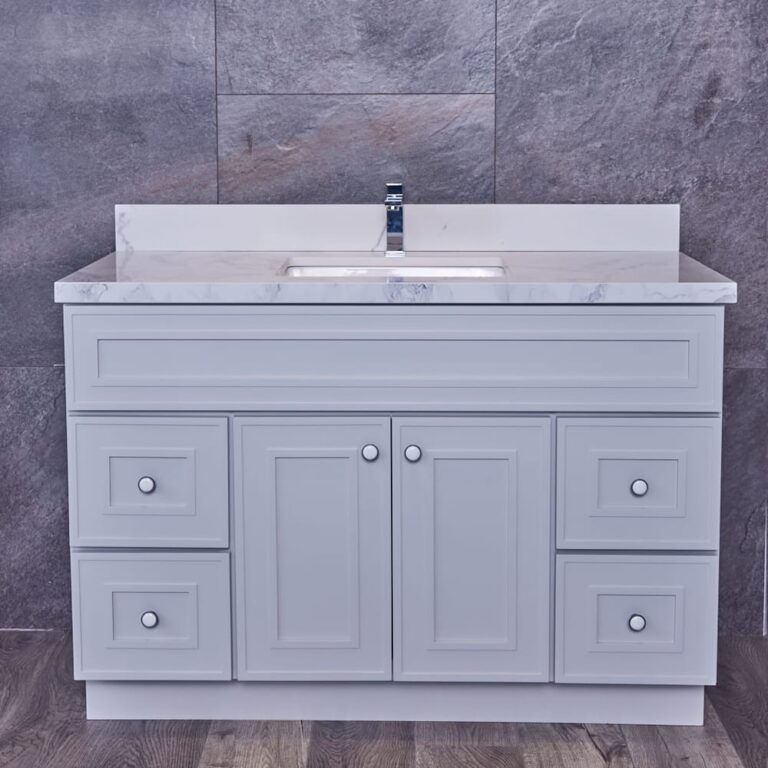 Gray bathroom vanity with marble countertop and modern faucet.