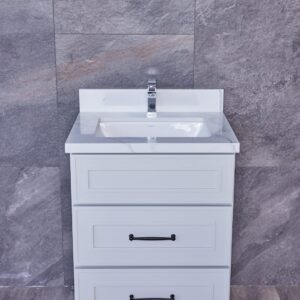 White bathroom vanity with three drawers and a sink, against a gray tiled wall.