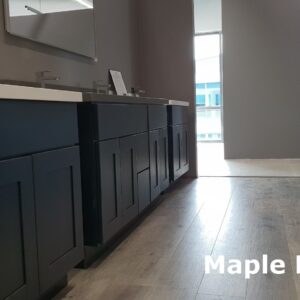 Dark maple kitchen cabinets with modern design and sleek countertops.