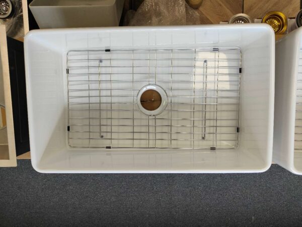 Butler sink protector in a white sink.