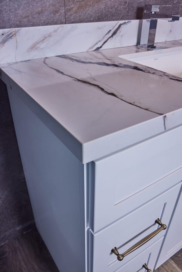 Marble countertop with sink in modern kitchen design.