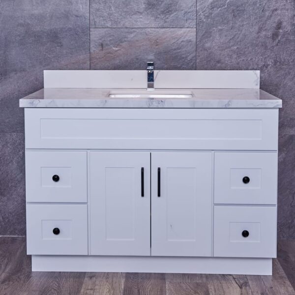 WS-3V4720D-1.jpg White bathroom vanity with marble countertop and sink.