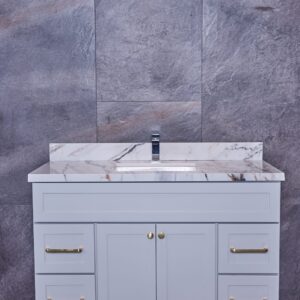 Modern bathroom vanity with marble countertop and gray cabinets.