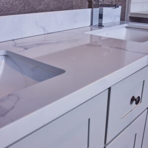 Modern kitchen countertop with marble finish and integrated sink.