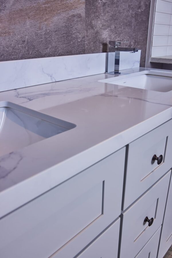 Modern kitchen countertop with marble finish and integrated sink.