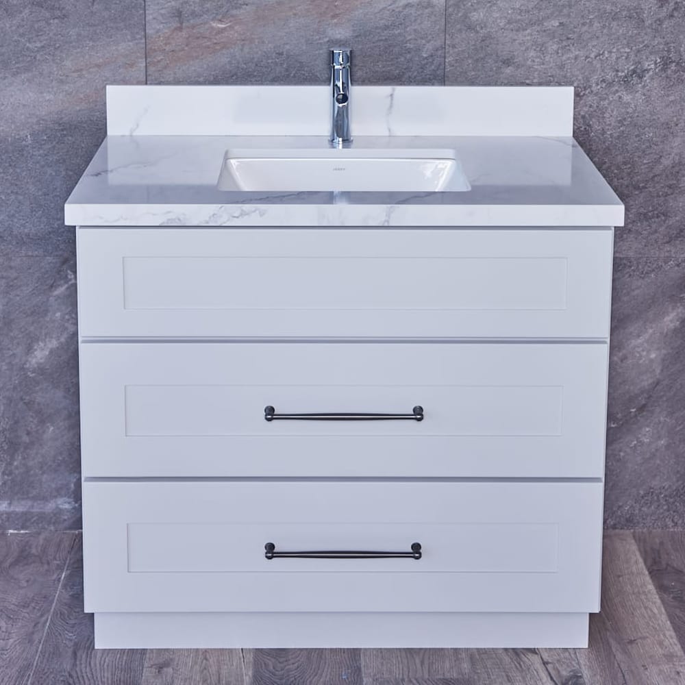 White bathroom vanity with marble countertop and two drawers.