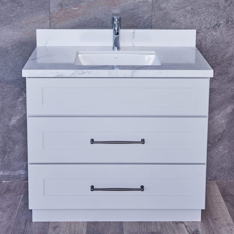 White bathroom vanity with marble countertop and two drawers.