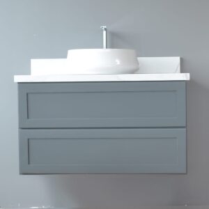 Gray wall-mounted vanity with white sink against a light gray wall.