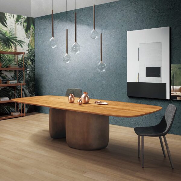Modern dining room with wooden table and pendant lights.