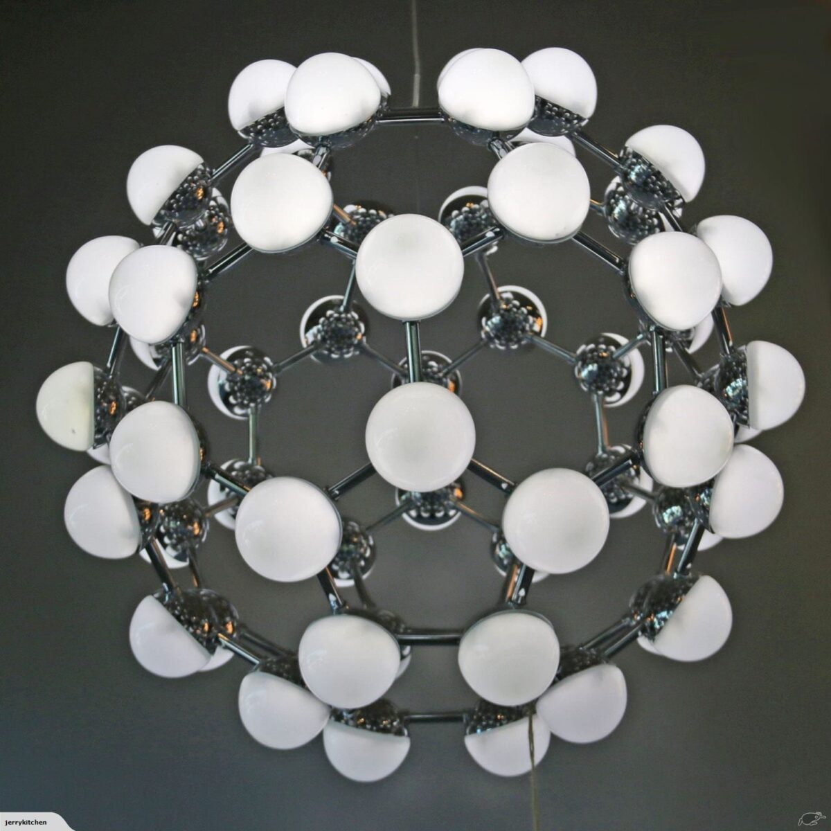 Modern spherical chandelier with white globes and chrome finish.
