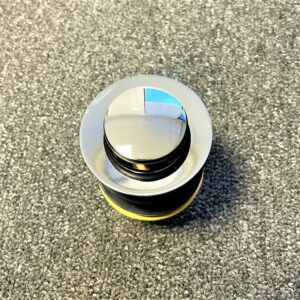 Chrome 32mm pop-up waste without overflow on textured surface.