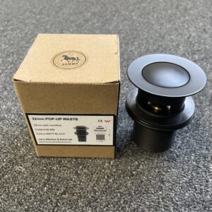 Matt black pop-up waste with overflow next to packaging box.