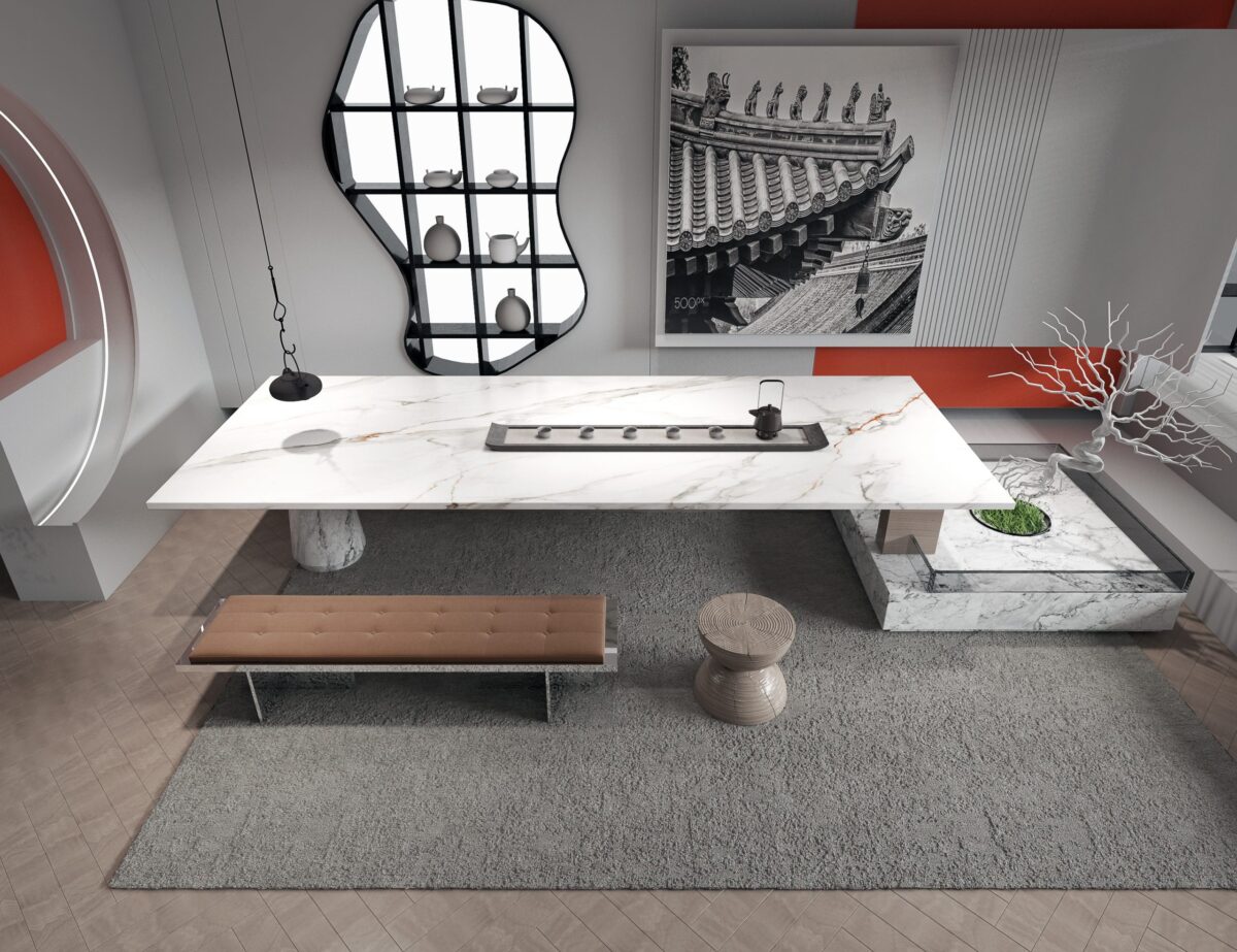 Modern kitchen with white marble island and decorative wall art.