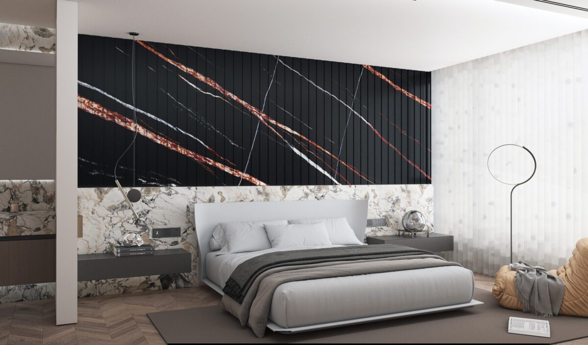 Modern bedroom with black and gold accent wall behind bed.