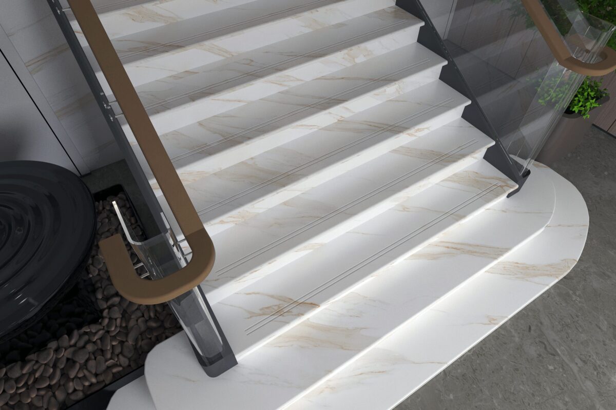 Marble staircase with glass railings and wooden handrails.