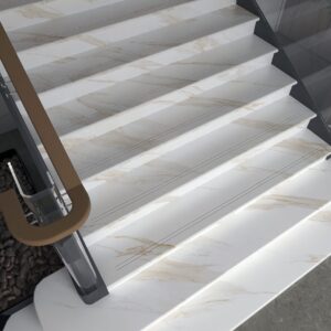 Marble staircase with glass railings and wooden handrails.