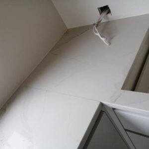 Calacatta Belleza countertop installation in modern kitchen.