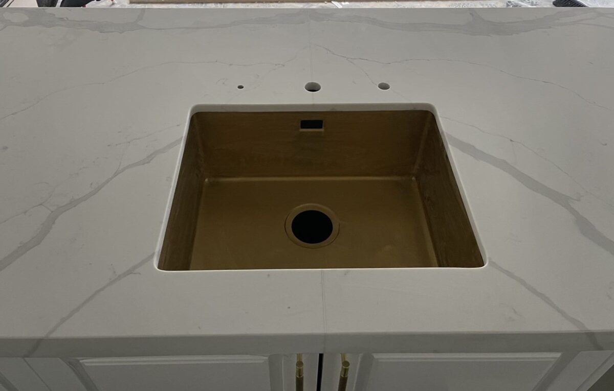 Calacatta Sky Quartz countertop with a built-in sink.