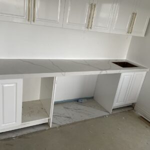 White kitchen cabinets with Calacatta Sky Quartz countertop.