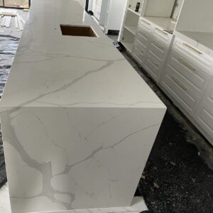 Calacatta Sky Quartz countertop in modern kitchen setting.