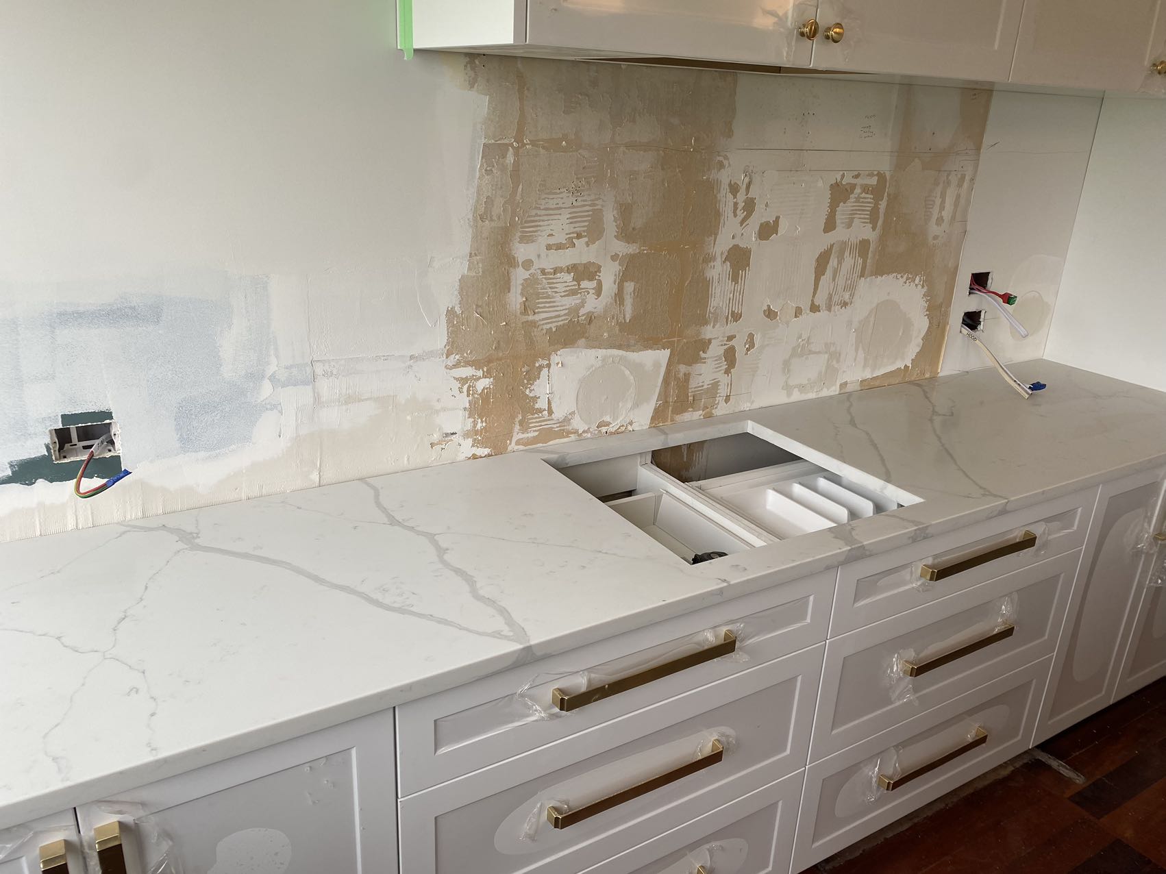 Calacatta Sky Quartz countertop installation in progress in a kitchen.