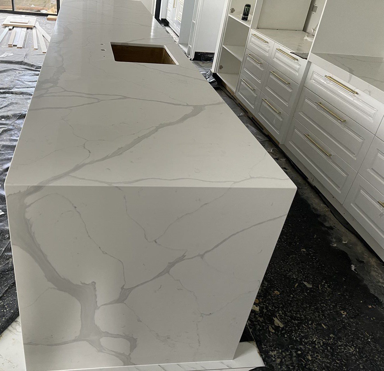 Calacatta Sky Quartz countertop in modern kitchen setting.