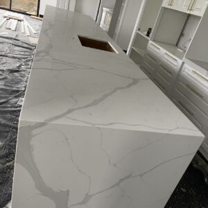 Calacatta Sky Quartz kitchen countertop installation in progress.