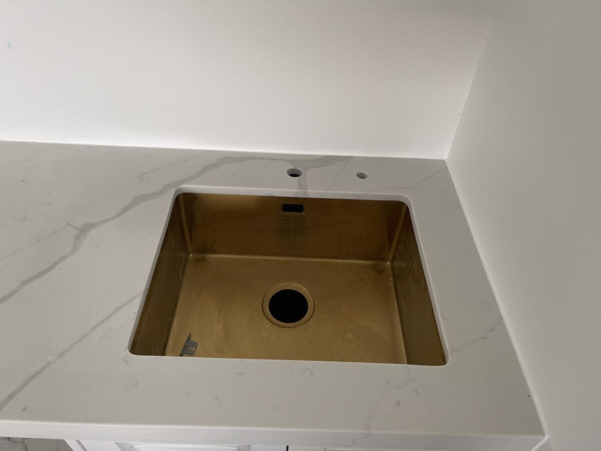 Calacatta Sky Quartz countertop with a square sink.