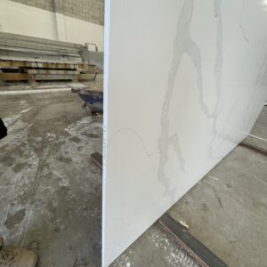 Marble slab in a warehouse, side view.