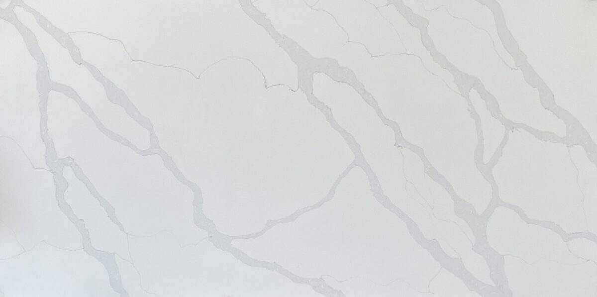 White marble countertop with subtle gray veining.