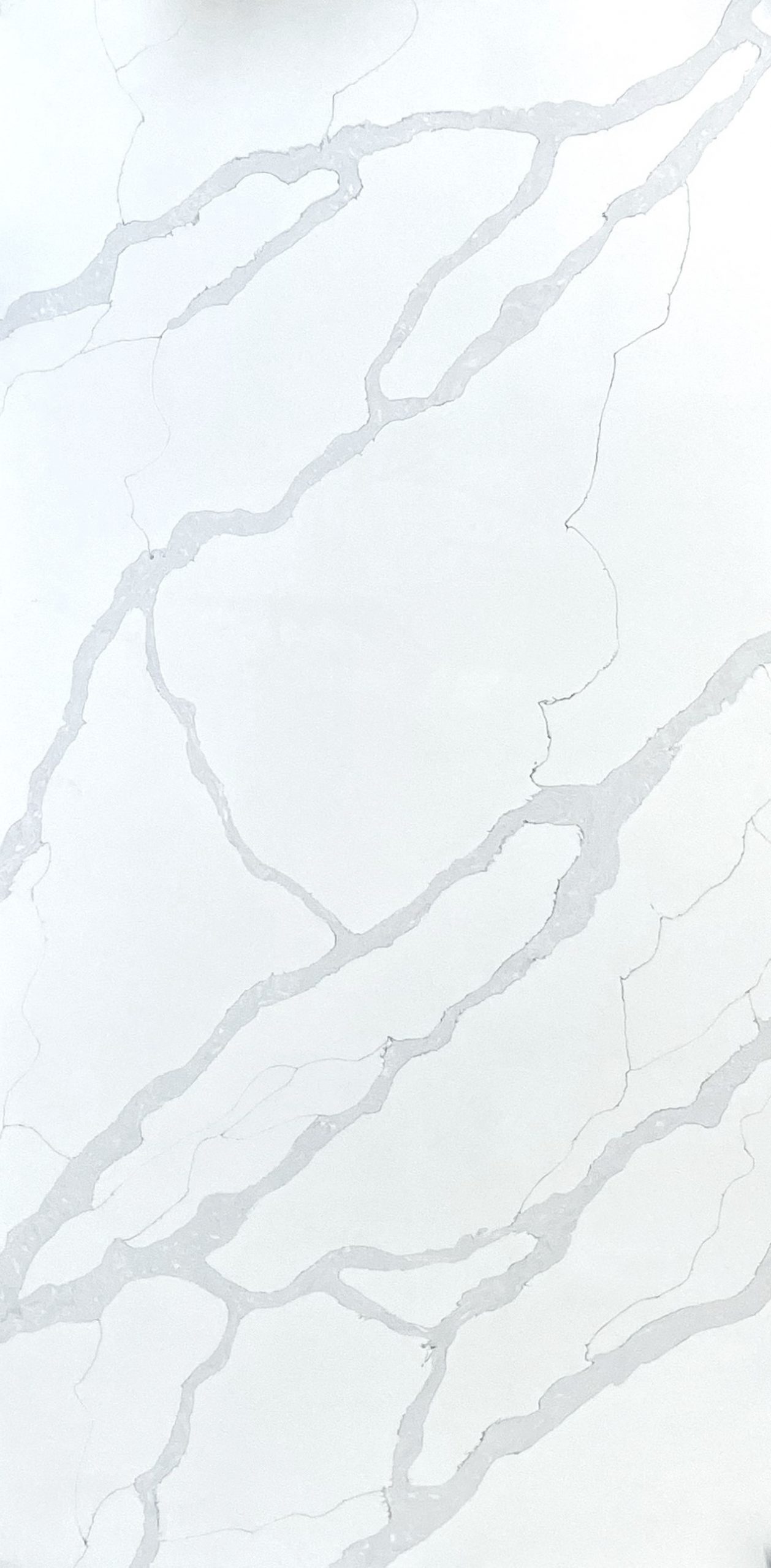 White marble slab with subtle grey veining for kitchen countertops or vanity tops