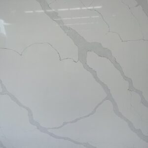 White marble countertop with gray veining pattern.